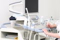 Woman sonographer using ultrasound machine at work Royalty Free Stock Photo