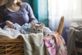 woman sorting laundry, cat hiding in the basket Royalty Free Stock Photo