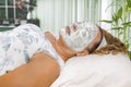 Woman In A Spa With A Facial Kiwi Skin Mask Treatment Royalty Free Stock Photo