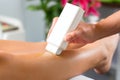 Woman in Spa getting leg waxed Royalty Free Stock Photo