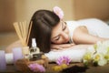 Woman at the spa. Healthy lifestyle and relaxation concept. A beautiful young woman on a massage table. Aroma oil and butter. Spa Royalty Free Stock Photo