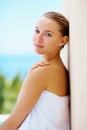 Woman, spa and outdoor with skincare, health or hands with face for results with blue sky background. Girl, touch skin