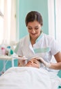 Woman in spa salon receive skin ultrasonic cleaning treatment of the face Royalty Free Stock Photo