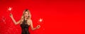 Woman with sparkler celebrating New Year Christmas Birthday party. Portrait of beautiful blonde smiling girl in shiny black dress Royalty Free Stock Photo