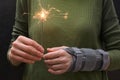 Woman With Sparkler and Contused Hand