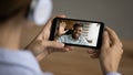 Woman speak on video call on cellphone with friend Royalty Free Stock Photo