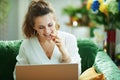 Woman speaking with dentist in modern living room in sunny day Royalty Free Stock Photo