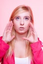 Woman speaking, young girl whispering over pink