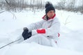 A woman in a special winter suit. Amid the snow