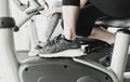 Woman spinning on Fitness gym bike machine Royalty Free Stock Photo