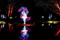 Woman spinning illuminated by a long exposure light painting in Norrviken, Sweden,