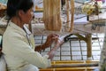 Woman spinning thailand traditional yarn thread Royalty Free Stock Photo