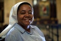 Woman and spirituality, portrait of catholic nun praying in church