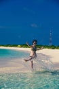 Woman splash water. Idyllic paradise island landscape. Exotic tropical beach. Summer vacation, luxury holiday resort, tourism conc