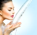 Woman with splashes of water in her hands Royalty Free Stock Photo