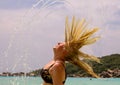 Woman splashing water with her hair Royalty Free Stock Photo