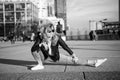 Woman split leg on grey pavement in paris, france