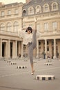 Woman split leg on square in paris, france