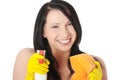 Woman with sponge and spray