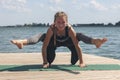 Woman with sport bra doing yoga fitness exercise for relax and healthy at lake in morning, Nature background, Concept outdoor Royalty Free Stock Photo