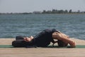 Woman with sport bra doing yoga fitness exercise for relax and healthy at lake in morning, Nature background, Concept outdoor Royalty Free Stock Photo