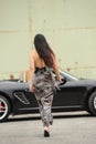 Woman and sports car