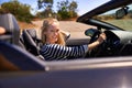 Woman, sports car and portrait on road trip, nature and luxury transport on summer drive. Female person, holiday and Royalty Free Stock Photo