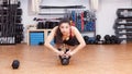 Woman sports push up on kettlebell Royalty Free Stock Photo