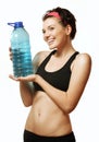 Woman in sportswear clothes with a water bottle in hand