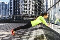 Woman in sportswear is doing workout outdoors Royalty Free Stock Photo