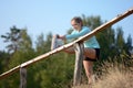 Sporty woman stretches legs after jogging, running and exercising outdoors in nature Royalty Free Stock Photo