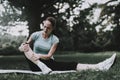 Woman in Sportswear after Yoga Exercises in Park.