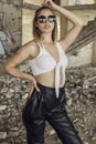 Woman in sporty clothes posing at abandoned construction site Royalty Free Stock Photo