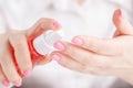 Woman spraying insect repellent on her hand Royalty Free Stock Photo