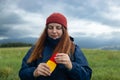 Woman spraying insect repellent at her hand. Woman using anti mosquito spray outdoors at hiking trip Royalty Free Stock Photo