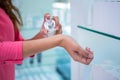 Woman spraying perfume on her wrist Royalty Free Stock Photo