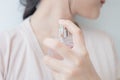 Woman is spraying perfume at the neck Royalty Free Stock Photo