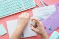 woman sprays alcohol disinfectant on her hands, office, notebook, medical mask, keyboard, mouse, stationery. Royalty Free Stock Photo