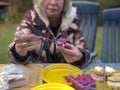 Woman spreading beetrot on a bread Royalty Free Stock Photo