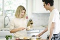 Woman spreading vegan cream cheese on a toast