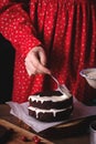 Woman spreads cream on a cake Royalty Free Stock Photo