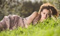 Woman in spring green grass Royalty Free Stock Photo