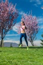 Woman in spring running or jogging as sport