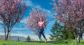 Woman in spring running or jogging as sport