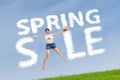 Woman with spring sale sign