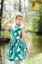 Woman in spring, summer park in green banana dress