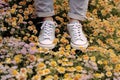 woman spring white young green grass lifestyle sneakers female flowers fashion. Generative AI. Royalty Free Stock Photo