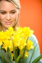 Woman with spring yellow flower narcissus Royalty Free Stock Photo