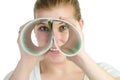 Woman spying through double roll of paper Royalty Free Stock Photo