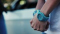 Woman squeeze hands. Blue watch. Bracelet. Constraint. Get rattled